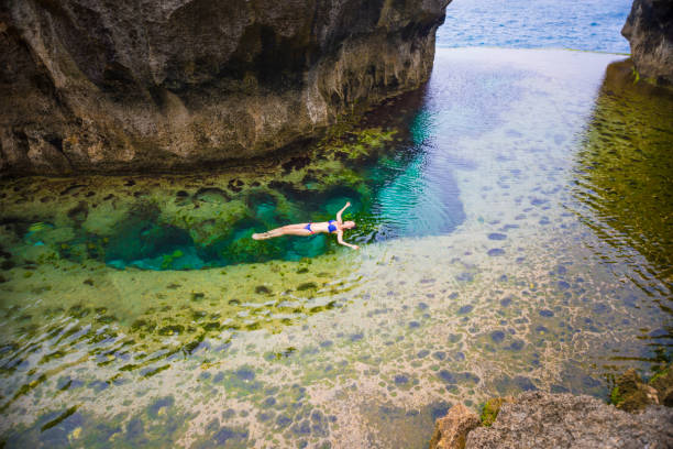 Emerald green natural infinity pool at Angel's Billabong Nusa Penida
