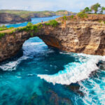 Massive natural rock archway over the ocean at Broken Beach